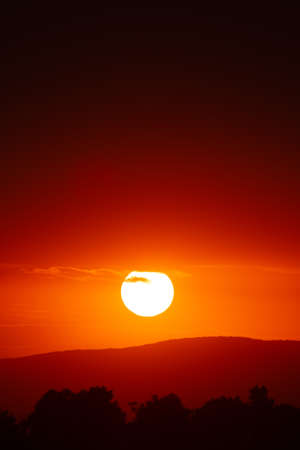 Beautiful sunset sky above clouds with dramatic light.の写真素材