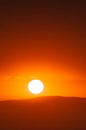 Beautiful sunset sky above clouds with dramatic light.の写真素材