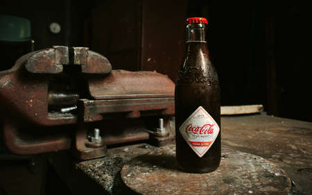 bottle of retro coca cola on the bench. Timisoara. Romania 11TH JULY 2019のeditorial素材
