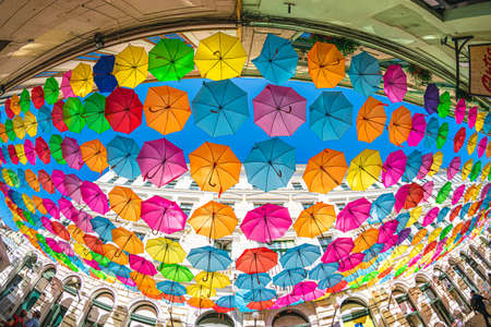 Colored umbrellas hanging between buildings, festival days in Timisoara, Romania JULY 4, 2019のeditorial素材