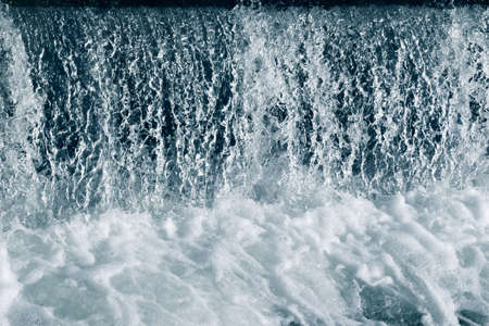 Blue and turquoise water with irregular wave structureの写真素材