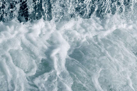 Blue and turquoise water with irregular wave structureの写真素材