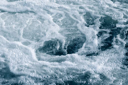Blue and turquoise water with irregular wave structureの写真素材