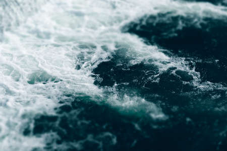 Blue and turquoise water with irregular wave structureの写真素材