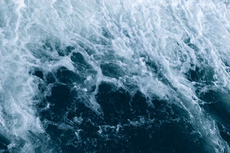 Blue and turquoise water with irregular wave structureの写真素材