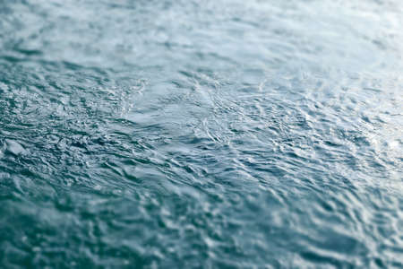 Blue and turquoise water with irregular wave structureの写真素材