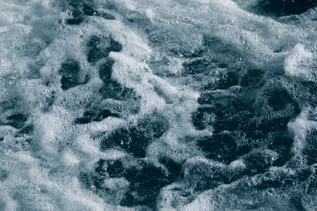 Blue and turquoise water with irregular wave structureの写真素材