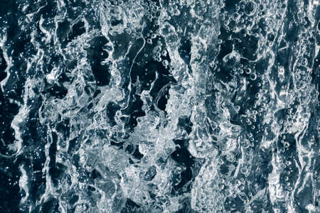 Blue and turquoise water with irregular wave structureの写真素材