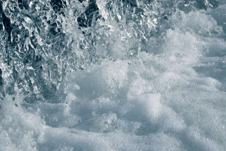 Blue and turquoise water with irregular wave structureの写真素材