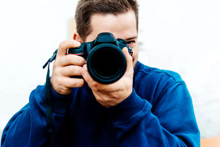 photographer takes street photos with a DSLR in downtown Timisoara.の写真素材