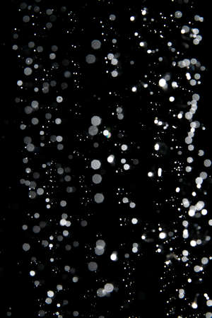abstract splashes of water on a black backgroundの写真素材