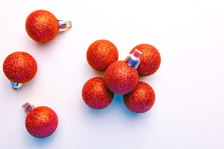 red christmas balloons with glitter on white backgroundの写真素材