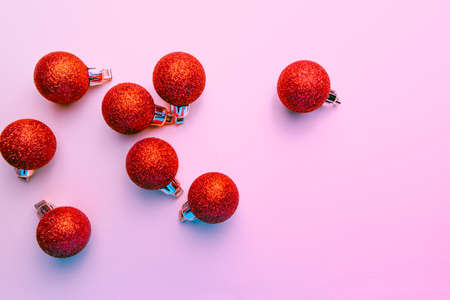 red christmas balloons with glitter on pink backgroundの写真素材