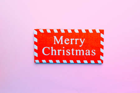 banner on pink background which writes merry christmasの写真素材