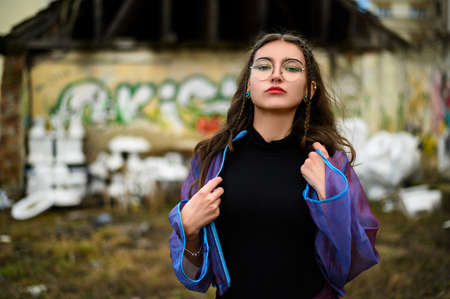 Sexy woman in glasses close-up looks directly into the camera
