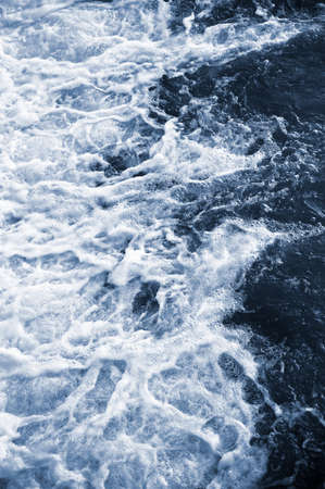 Blue and turquoise water with irregular wave structureの写真素材