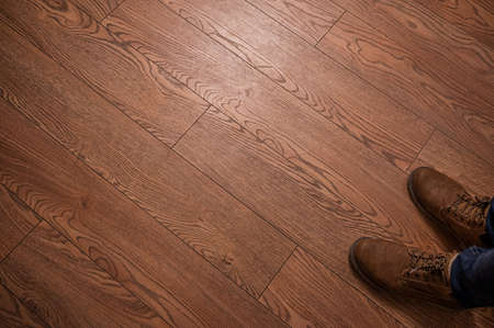 classic brown leather men's shoes on wooden backgroundの写真素材