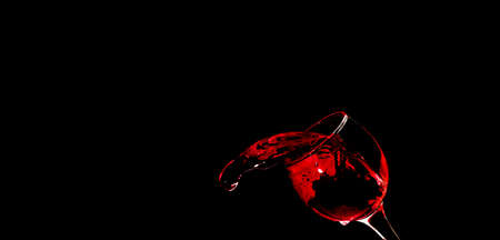 Pour water into glass on black background.の写真素材