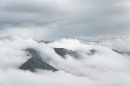 Landscape with Retezat mountains covered with clouds seen from 2485 meters. Retezat National Park, Hunedoara, Transylvania, Romaniaの写真素材