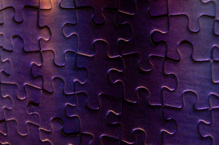 background of correctly placed colored puzzle piecesの写真素材