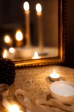 Candles, a ring and a fortune-telling mirrorの写真素材