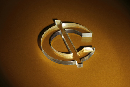 Currency unit on the red carpet with shadowの写真素材