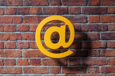 International at sign icon front of the British style wall