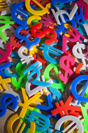 Hundreds of colorful economy icons on recycle paperの写真素材