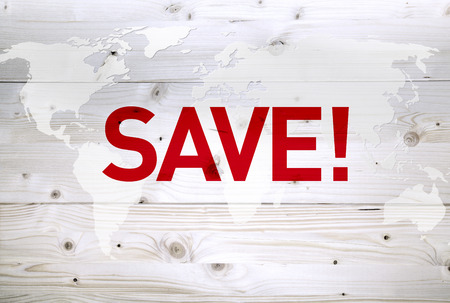 International save article on world map wooden backgroundの写真素材