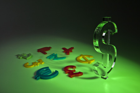 World economy map with colorful international icons on greenの写真素材
