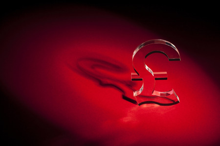 World's money currency icons on red backgroundの写真素材