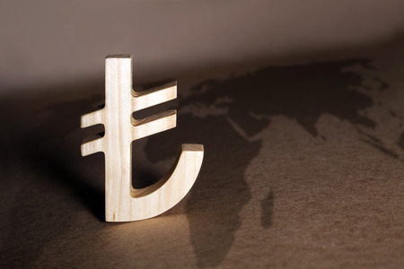 Wooden economy and currency units on craft backgroundの写真素材
