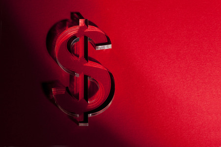 World's money currency icons on red backgroundの写真素材