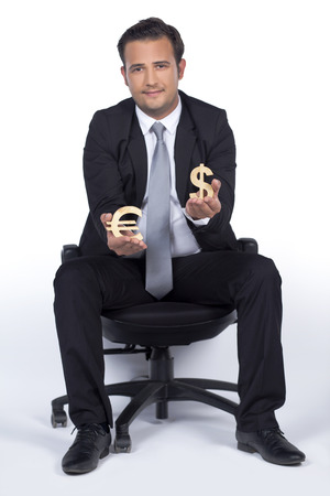Businessman is holding Euro and Dollar iconsの写真素材