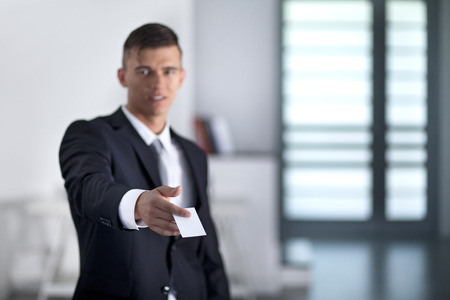 Businessman giving to someone business cardの写真素材
