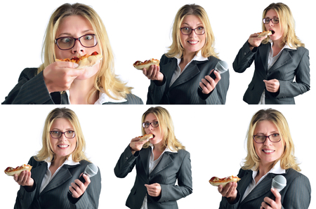 Business woman is eating pizza isolated on white backgroundの写真素材