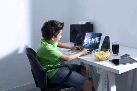 Game illness young boy is playing game on computer