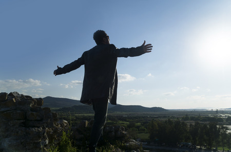 Healthy and happy young man greets the nature