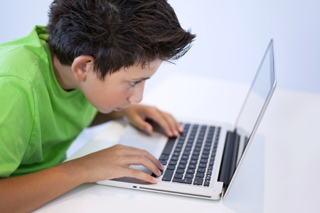 Game illness young boy is playing game on computer
