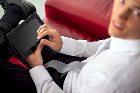 Young successfull businessman is using the tablet PCの写真素材