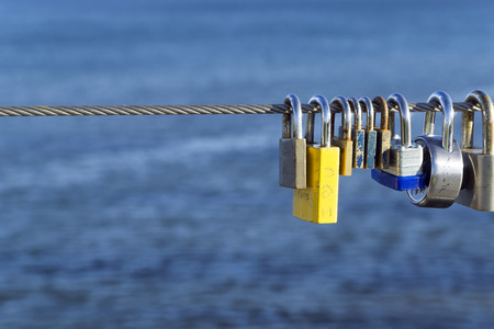 Padlocks hang on steel rope for wishing love or marriageのeditorial素材