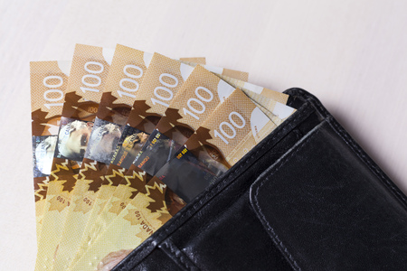 Canadian Dollars in a open black leather walletの写真素材