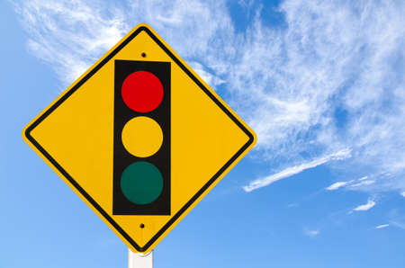 warning traffic sign on blue skyの写真素材