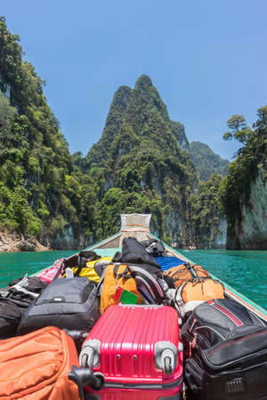luggage on transport boat go to island