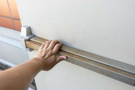 hand push the door for escape fire