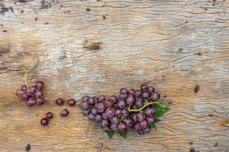 top view of bunch grape on old wood. copy space for textの写真素材