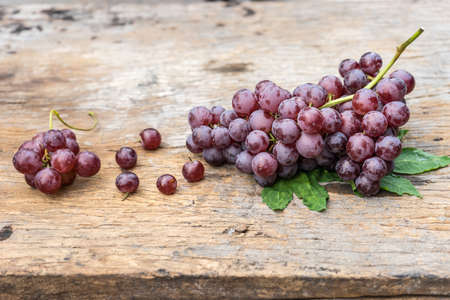 bunch grape on old wood.の写真素材