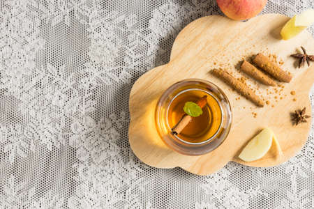 top view hot apple juice in glass with cinnamon. autumn food conceptの写真素材