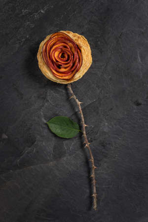 top view of apple pie rose form on stone texture. representative of loveの写真素材