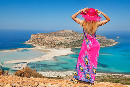 A beautiful woman over the beach Balos of Creta, Greeceの写真素材